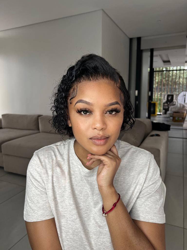 Lerato Kganyago Ndlala wearing short curly wig human hair from The San Hair Lady, it is the Riri 13x4 wig which is a water wave Malaysian hair unit.