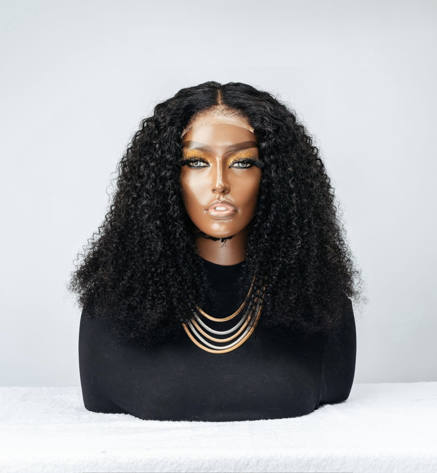 Jerry Curl (4x4 Closure) Wig has tight curls and is a glueless unit.